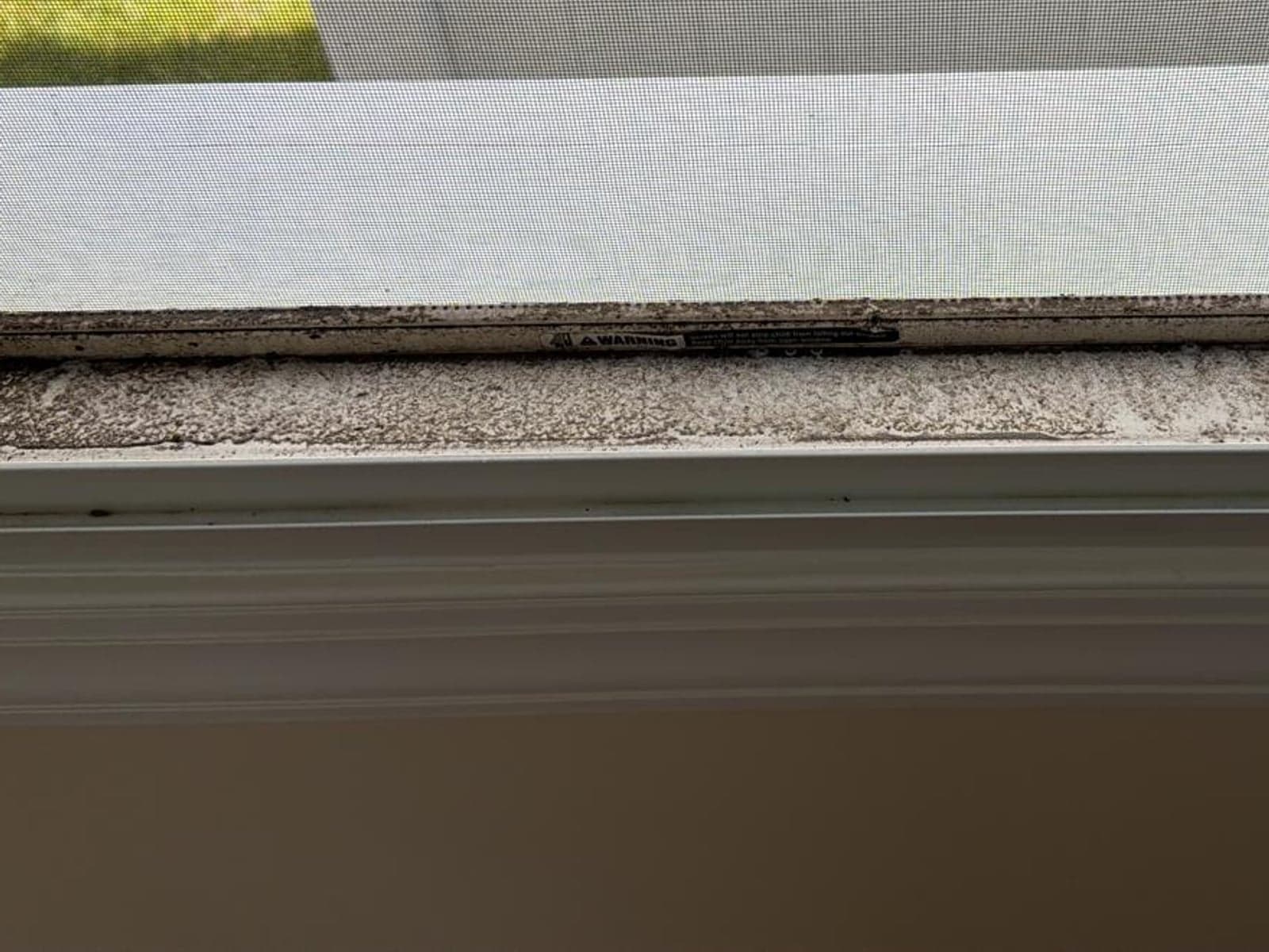 Window track and sill in a New Jersey home — before